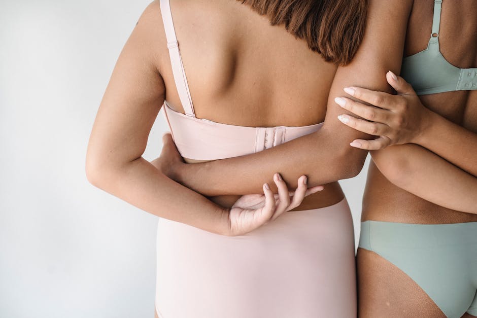 A close-up of diverse women embracing body positivity and support in modern lingerie.